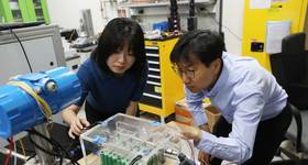 Research team at KIMM’s Heat Pump Research Center (Dr. Jinsub Kim pictured on the left)Dr. Jinsub Kim at KIMM operates the spray-based immersion cooling chamber.  Image Copyright KIMM