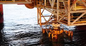 The damaged Blow Out Preventer (BOP), along with the Lower Marine Riser Package (LMRP) Cap from Deepwater Horizon. U.S. Coast Guard photo by Petty Officer 1st Class Thomas M. Blue.
