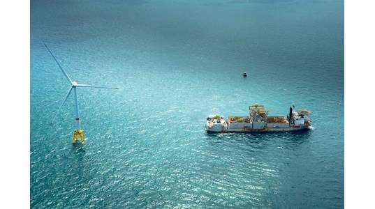 Wind build-up: turbine and service vessel, part of offshore wind’s continued surge (Photo: GE)