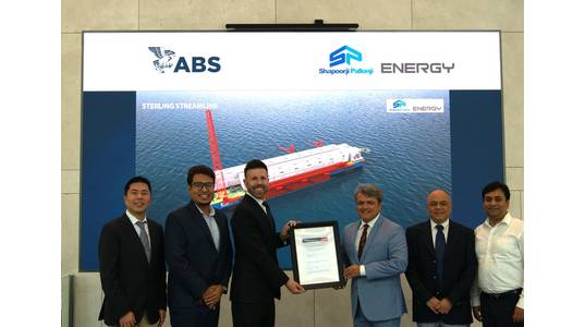 Center, left to right: Ben Ford, ABS Director, Business Development, and Ankit Garg, President Projects, SPE, hold the ABS AIP certificate. (Photo: ABS)