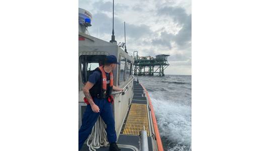 A Coast Guard Station Freeport 45-foot Response Boat-Medium boatcrew rescues three boaters aboard an oil rig after their vessel began sinking near Freeport, Texas on May 21, 2023. The boatcrew embarked the boaters and transferred them to Surfside Marina in Freeport. (U.S. Coast Guard photo by Station Freeport)