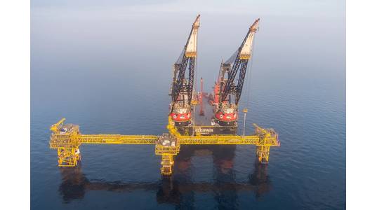 HMC Crane Vessel Sleipnir conducting installation work at Tyra - Credit: TotalEnergies Denmark