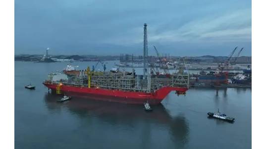 FPSO Leopold Sédar Senghor leaving the quayside at COSCO Shipyard in Dalian, China, in preparation for its tow to Keppel Shipyard in Singapore in 2022. Image courtesy of Woodside.

