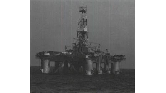 The Ocean Ranger, on the Hibernia
J-34 well off Eastern Canada during December 1981, is shown at the 80-foot drilling
draft. Some of the twelve anchor cables are
visible running from the fairleads on the corner columns - Credit: Government of Canada
