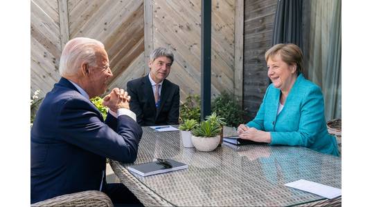 File photo: President Joe Biden meets for a brief pull-aside meeting with German Chancellor Angela Merkel during the G7 Summit at the Carbis Bay Hotel and Estate on Saturday, June 12, 2021, in St. Ives, Cornwall, England. (Official White House Photo by Adam Schultz)