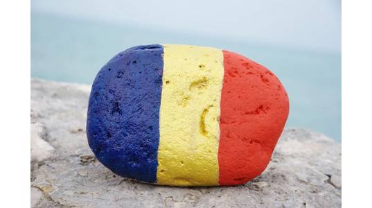 The Romanian flag colors on a stone - Image by  yournameonstones - AdobeStock