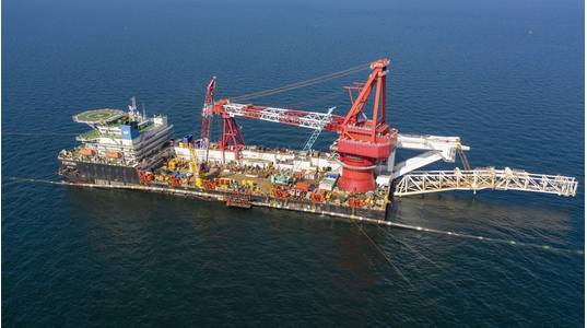 On September 10, 2021, the sections of the second Nord Stream 2 pipeline laid from the German shore and Danish waters was connected in a so-called above water tie-in. The opposing pipe strings were lifted from the seabed by the lay barge Fortuna and the pipe ends were cut and fitted together. The welding to connect the two lines took place on a platform located above the water on the side of the vessel. Then the connected pipeline was lowered to the seabed as one continuous string.

Source: © No