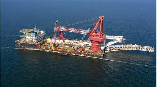 On September 10, 2021, the sections of the second Nord Stream 2 pipeline laid from the German shore and Danish waters was connected in a so-called above water tie-in. The opposing pipe strings were lifted from the seabed by the lay barge Fortuna and the pipe ends were cut and fitted together. The welding to connect the two lines took place on a platform located above the water on the side of the vessel. Then the connected pipeline was lowered to the seabed as one continuous string.©NordStream2