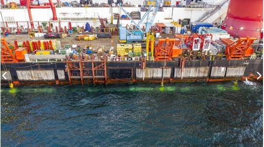 On September 10, 2021, the sections of the second Nord Stream 2 pipeline laid from the German shore and Danish waters was connected in a so-called above water tie-in. The opposing pipe strings were lifted from the seabed by the lay barge Fortuna and the pipe ends were cut and fitted together. The welding to connect the two lines took place on a platform located above the water on the side of the vessel. Then the connected pipeline was lowered to the seabed as one continuous string. Credit: Nord 