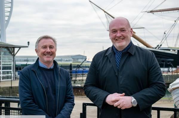 Eric Briar, Manor Renewable Energy (MRE) chief executive officer, and Toby Mead, MRE chief operating officer, look forward to growth as part of the OEG Offshore group at Portsmouth Historic Dockyard in front HMS Warrior.- Credit: Manor Renewable Energy