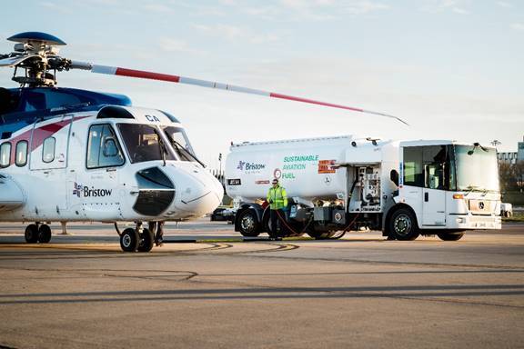 A Bristow S-92 is shown being refueled with sustainable aviation fuel at Aberdeen airport, marking one of the first SAF-powered flights to an offshore operation in the UK Continental Shelf. 
