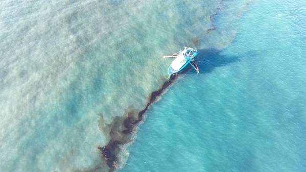 A Clean Gulf Associates 95-foot response vessel skims crude oil approximately 4 miles southeast off South Pass Louisiana, Nov. 17, 2023. (U.S. Coast Guard photo, courtesy Clean Gulf Associates)