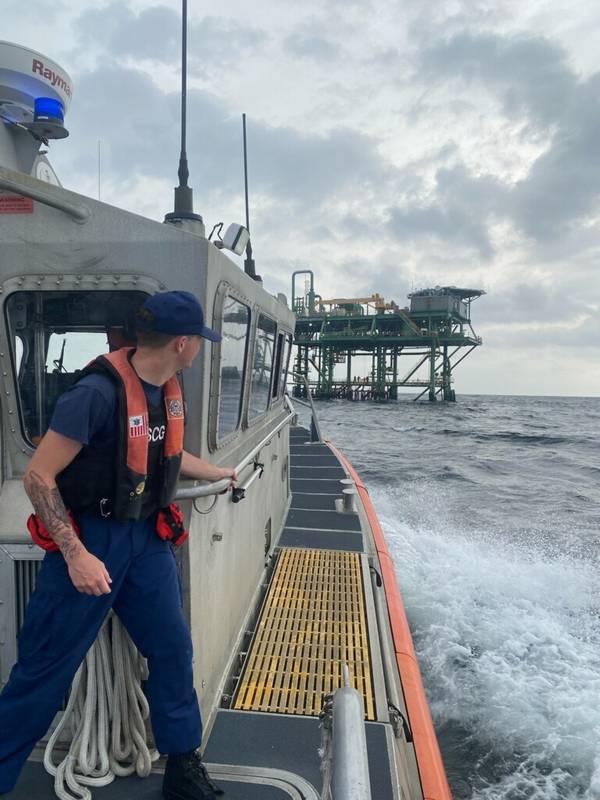 A Coast Guard Station Freeport 45-foot Response Boat-Medium boatcrew rescues three boaters aboard an oil rig after their vessel began sinking near Freeport, Texas on May 21, 2023. The boatcrew embarked the boaters and transferred them to Surfside Marina in Freeport. (U.S. Coast Guard photo by Station Freeport)