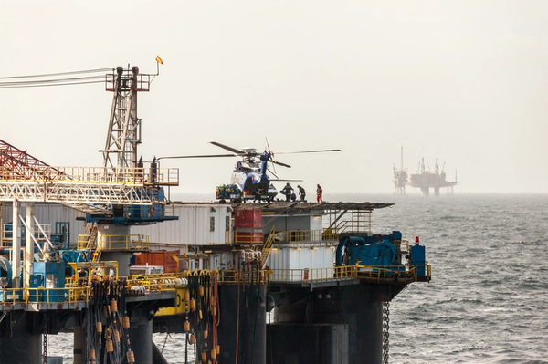 Illustration; Workers boarding helicopters on an offshore installation in the North Sea.