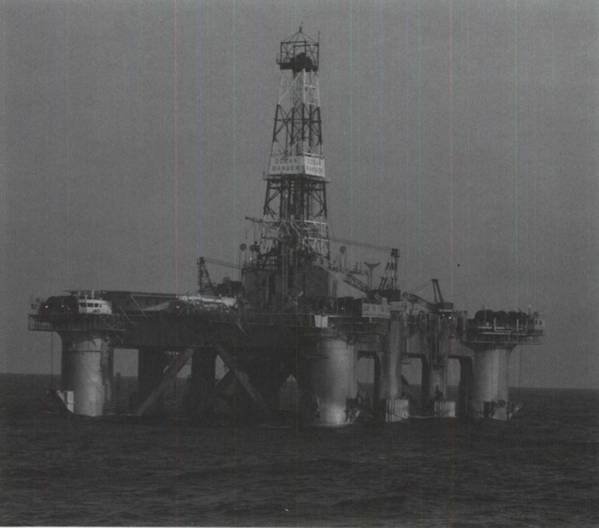 The Ocean Ranger, on the Hibernia
J-34 well off Eastern Canada during December 1981, is shown at the 80-foot drilling
draft. Some of the twelve anchor cables are
visible running from the fairleads on the corner columns - Credit: Government of Canada
