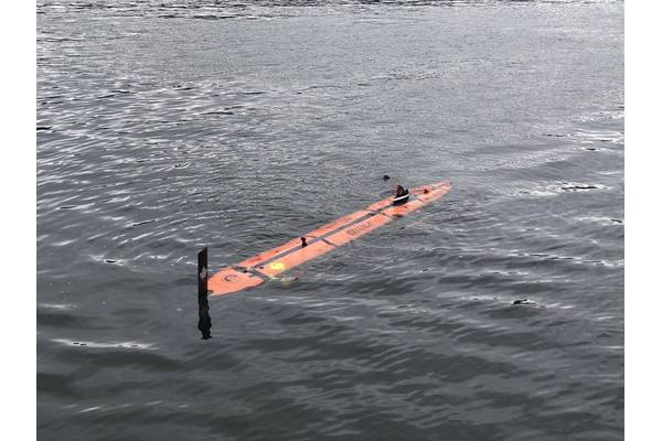 The mini AUV shown as it would be launched from the Solus LR underwater.