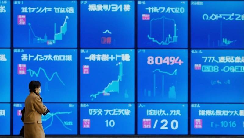 Japan data disappoints, but shares edge up on thinly traded holiday markets