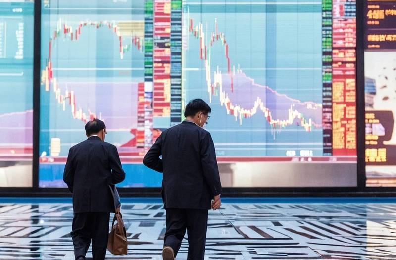 Asia shares and oil fall as markets revalue Fed expectations