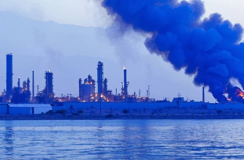 Iran media reports that the fire at a western Iranian mini refinery has been contained.