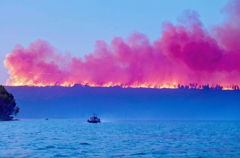Spain's biggest wildfire of the season burns for its fifth day, as a new heatwave approaches