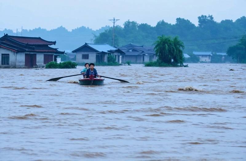 As flooding worsens, thousands of homes are submerged in China's South.
