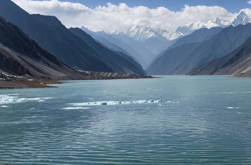 China warns that a lake formed near the Nepal border by glacier debris is starting to overflow