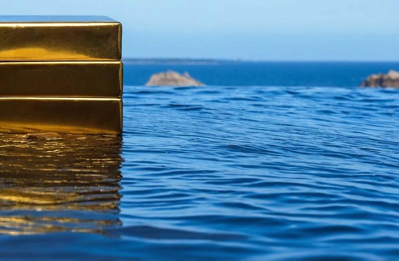 Gold falls on profit-taking following rally to over 3-month peak