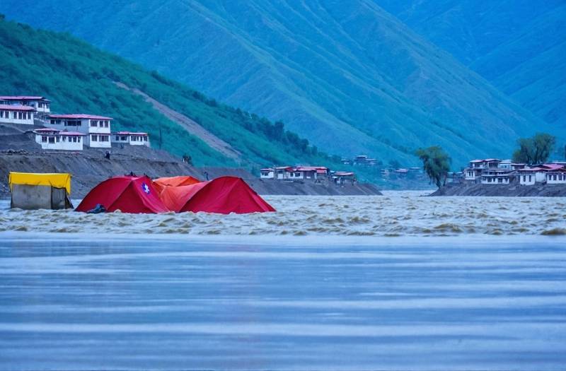 Nepal's flash floods wash away villages and project sites near Tibet's border